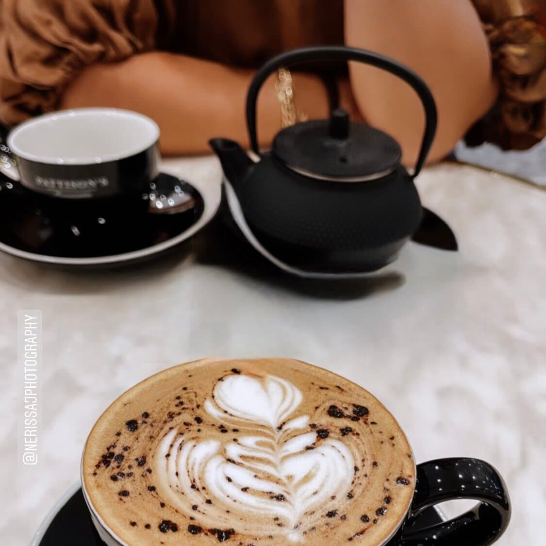 Coffee on a table during a pre-shoot consultation